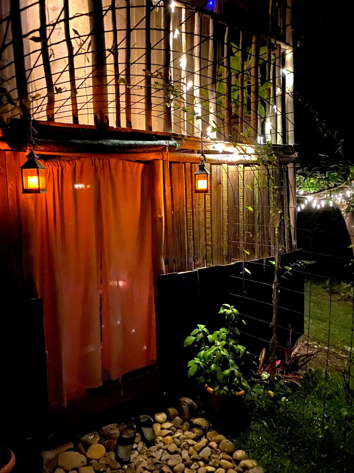 Private retreat wooden cabin entrance at night surrounded by nature in Costa Rica