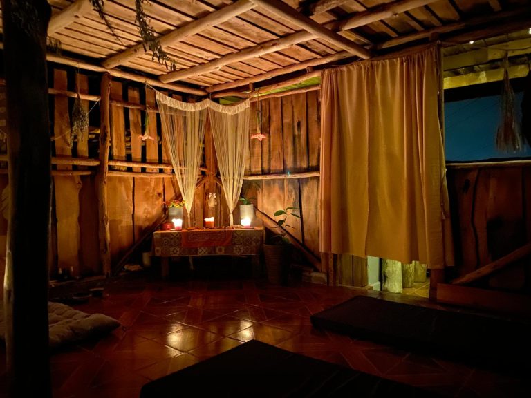 ceremonial mushroom house interior Costa Rica candlelight retreat space