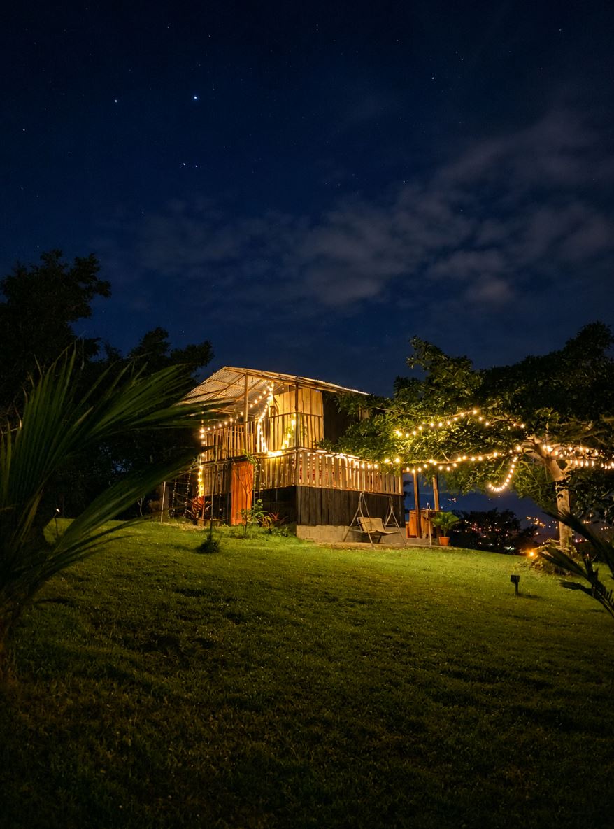 Rustic wooden retreat cabin at night under a starry sky
