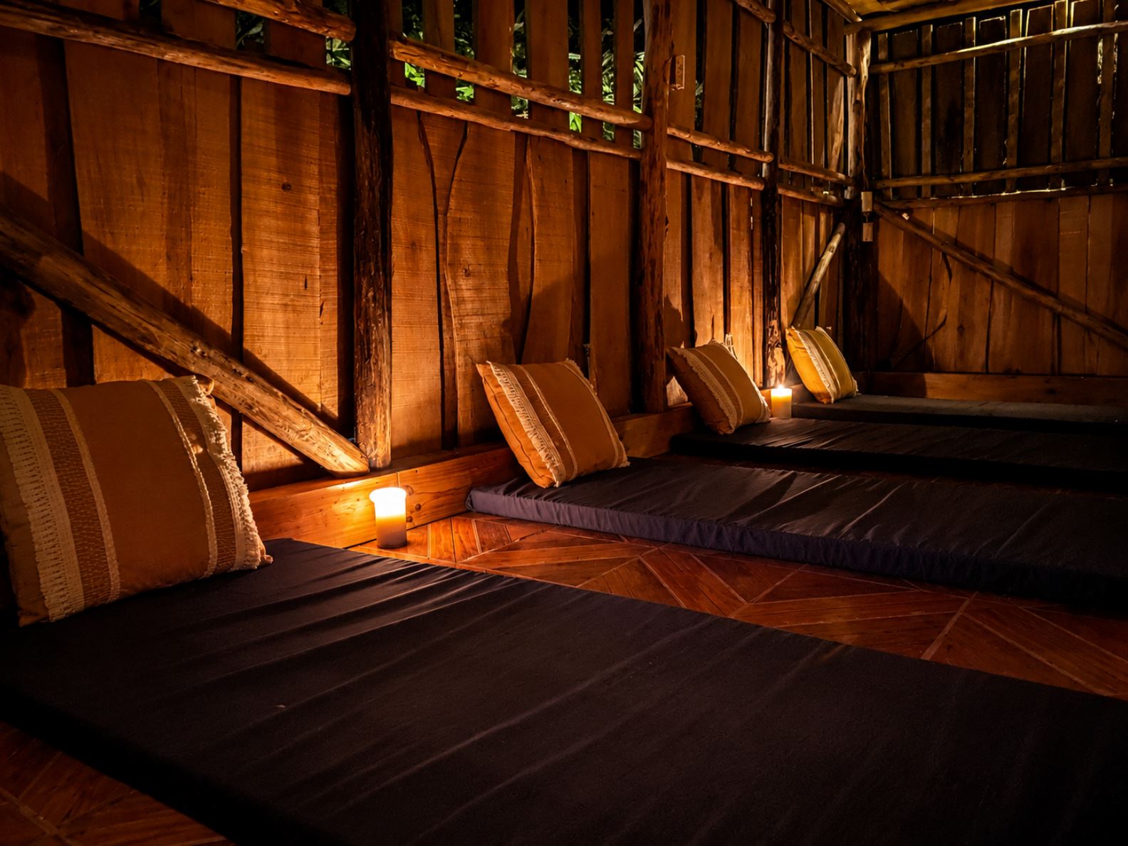 Candlelit private ceremony space inside a rustic wooden retreat cabin in Costa Rica